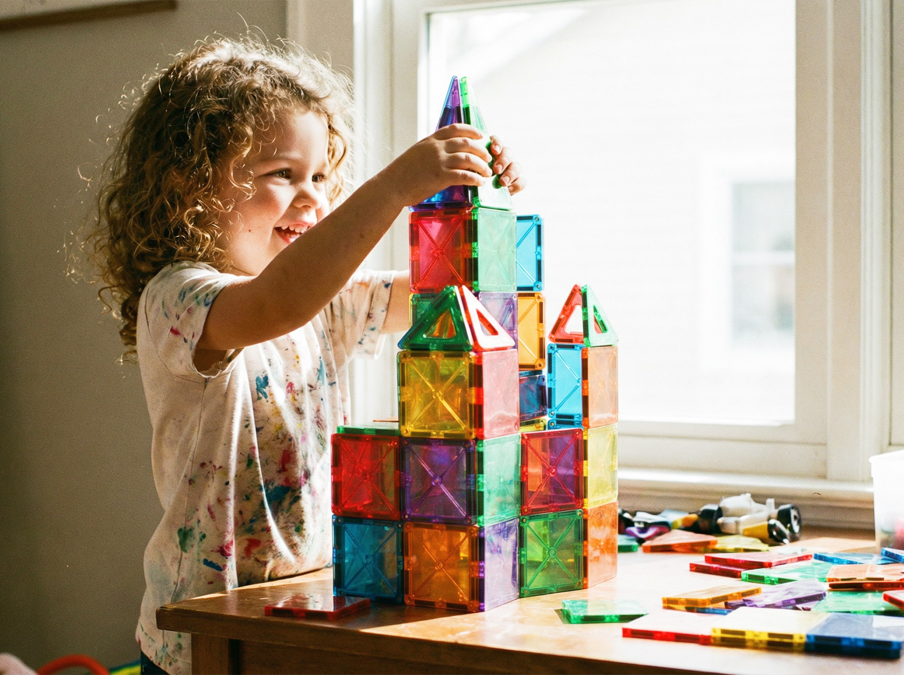 3 year old girl playing blocks