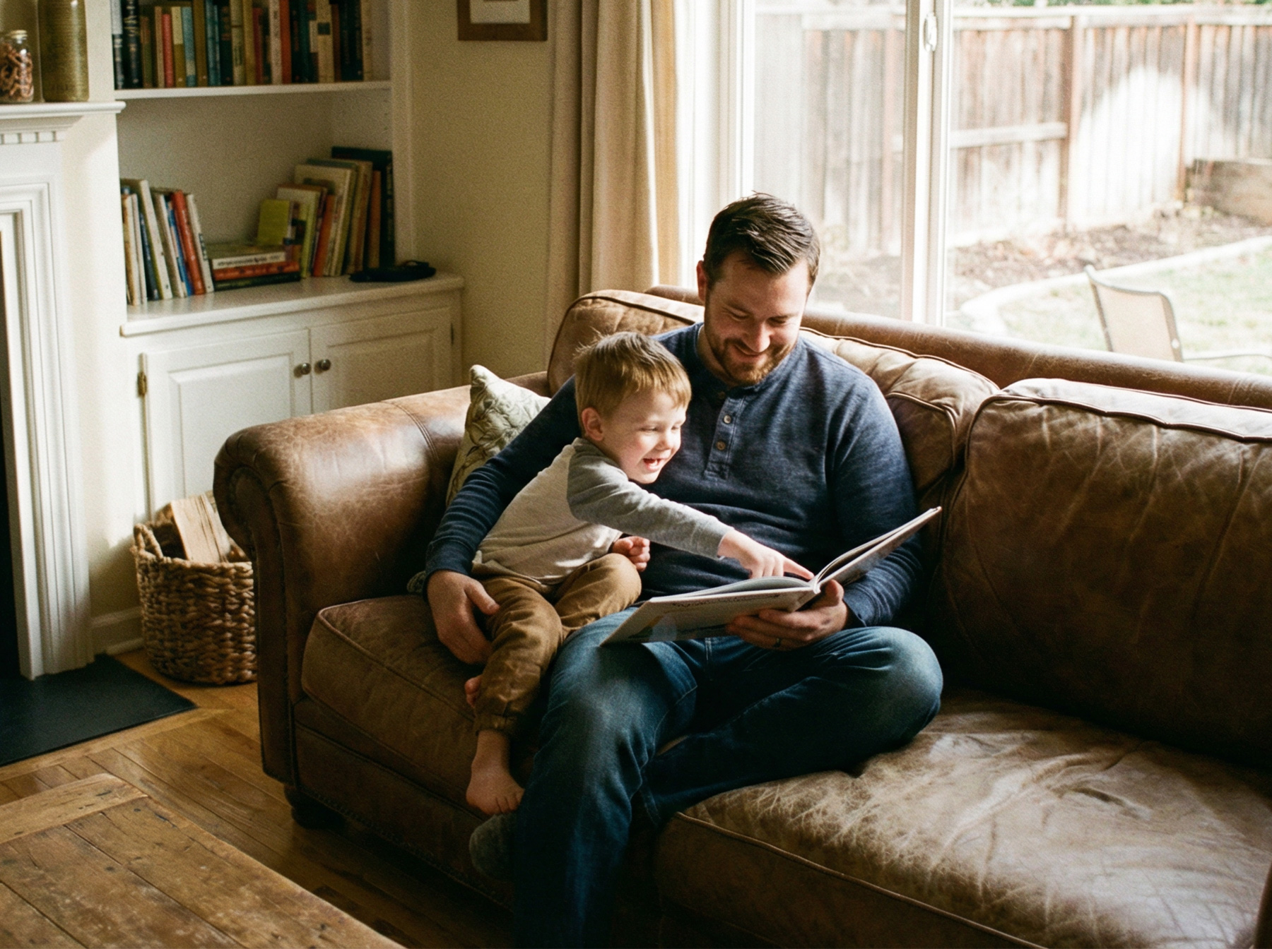 parent reading picture book with toddler boy