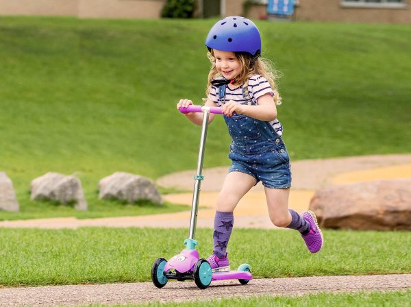 3-year-old girl riding a scooter