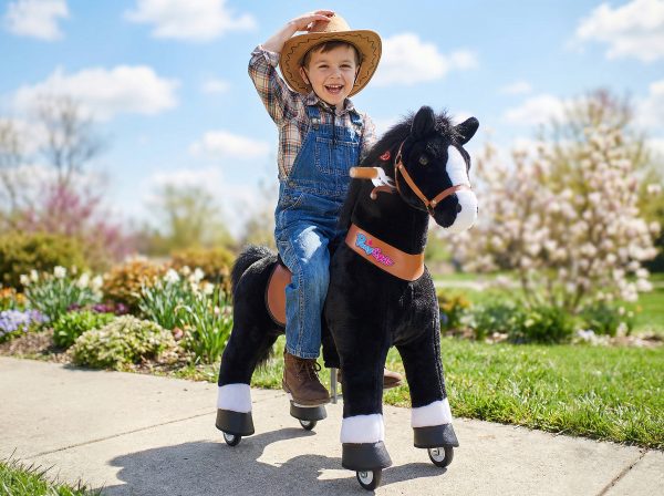 boy riding ponycycle ride on horse toy outdoors